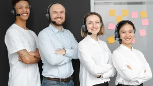 customer support team wearing headsets with sticky notes