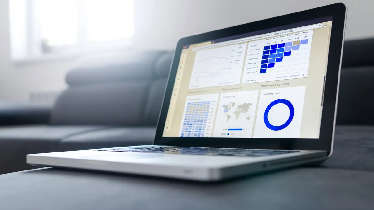 Best product analytics tools for SaaS startups laptop showing charts and a data dashboard