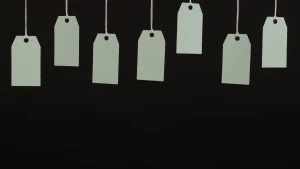 hanging price tags on a dark background