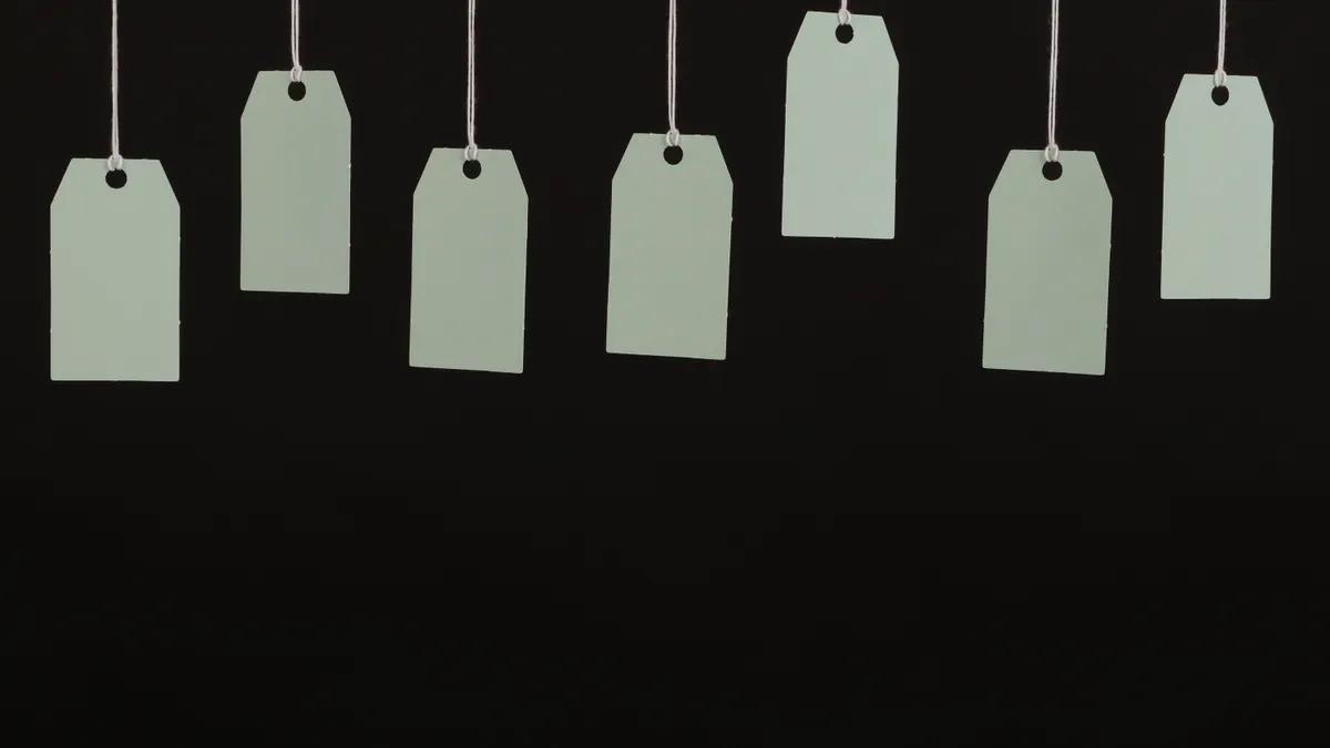 hanging price tags on a dark background