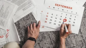hands marking a calendar date