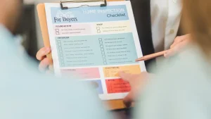 printed buyer checklist on a clipboard