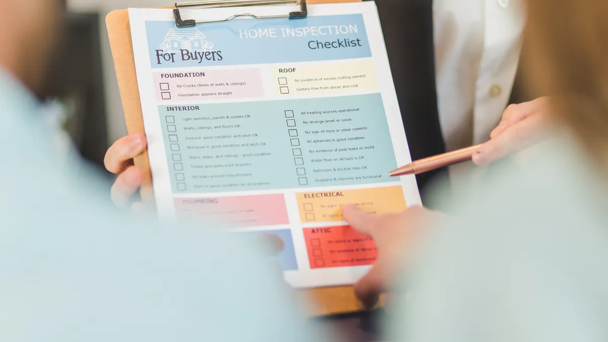printed buyer checklist on a clipboard