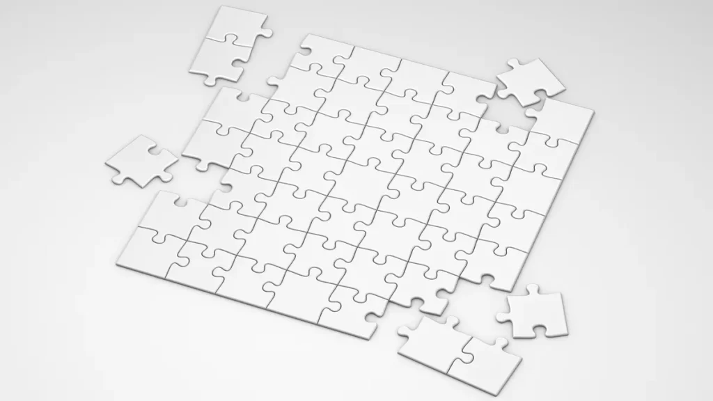 Partially assembled puzzle board with loose pieces