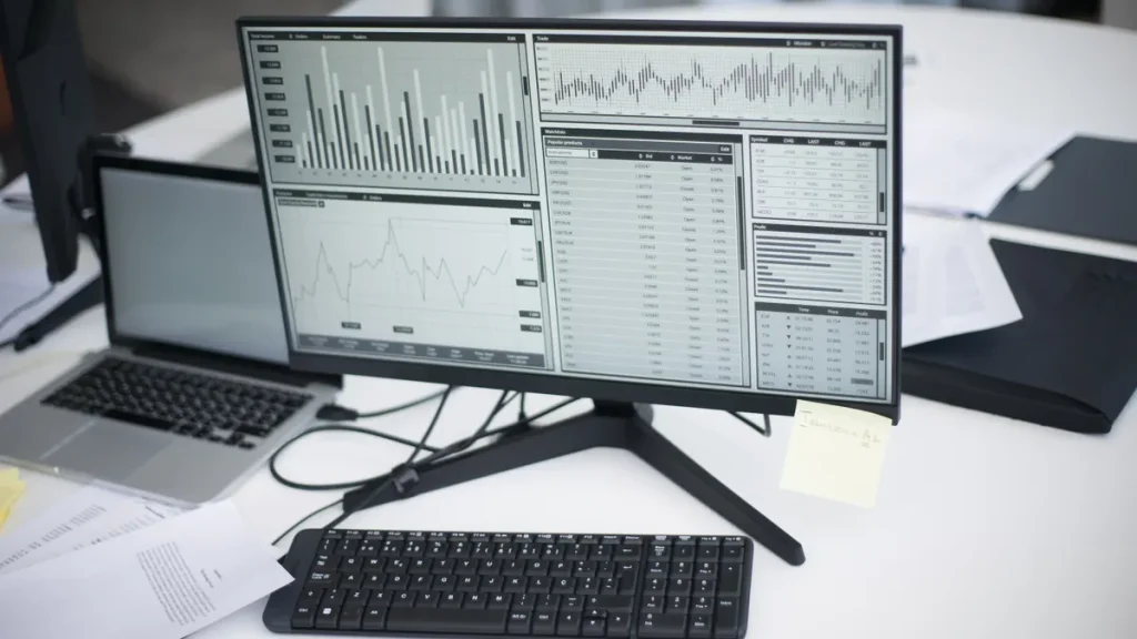 desktop monitor with multiple analytics charts and tables
